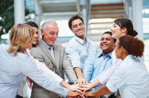 Diverse group of business team with hands together